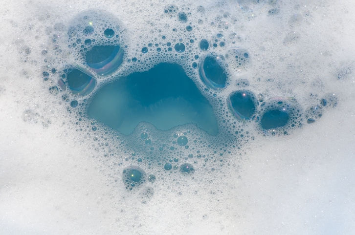 water mixed with detergent for cleaning hat