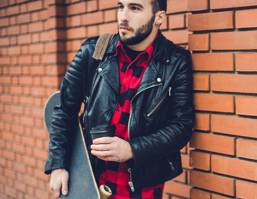 Walking with skateboard and coffee