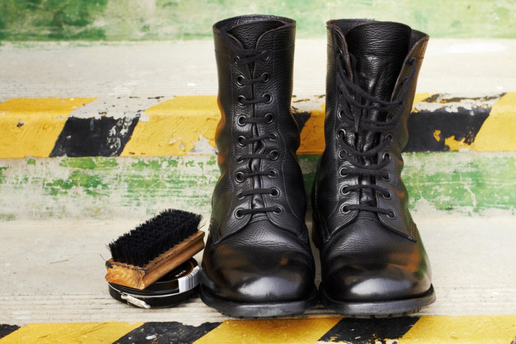 Shot of a pair of polished army boots sitting on some steps