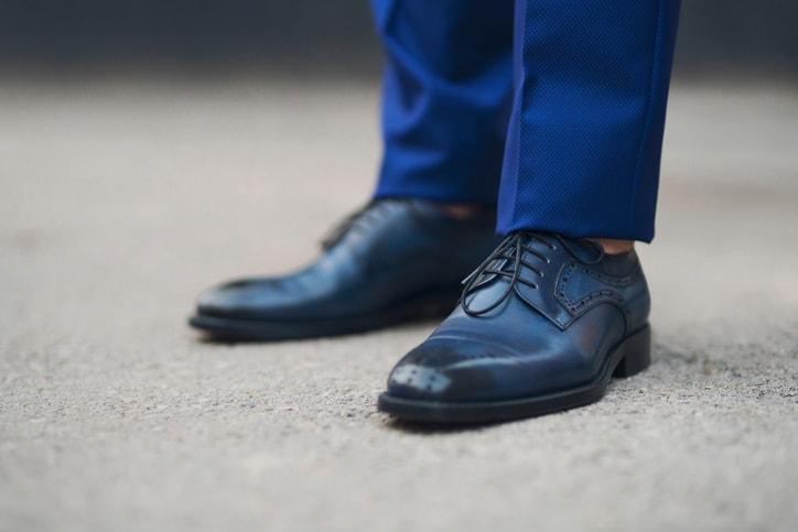 Close-up shot of a modern, elegant pair of men's leather shoes.