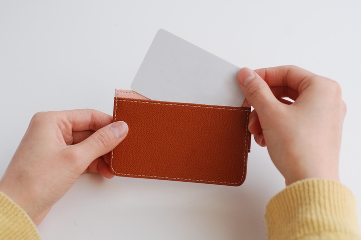 scene of putting card in wallet