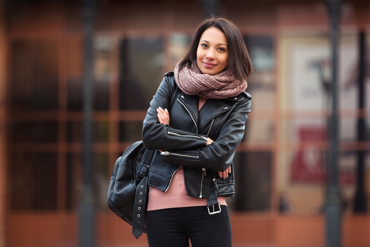 Girl smiling wearing leather jacket