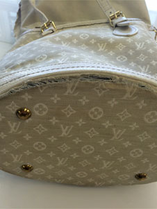 Louis Vuitton purse damaged bottom before replacement image 1