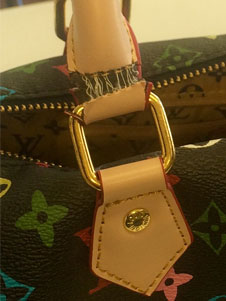 Louis Vuitton purse damaged handle before replacement image 1