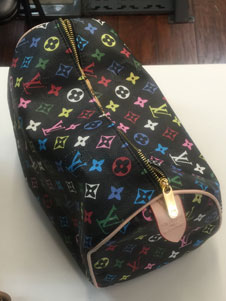 Louis Vuitton purse handle during repair Image 2