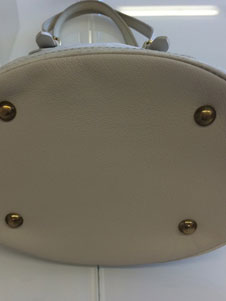 Louis Vuitton purse damaged bottom after replacement image 1