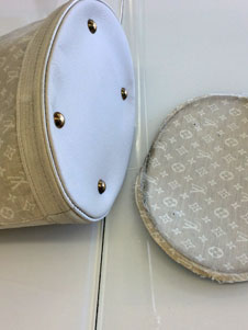 Louis Vuitton purse damaged bottom after replacement image 2